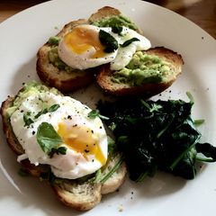 A picture of Poached Eggs with Avocado and Spinach.