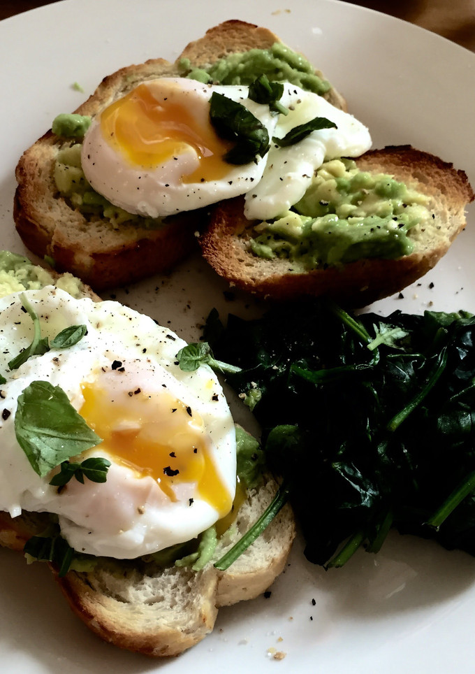 A picture of Poached Eggs with Avocado and Spinach.
