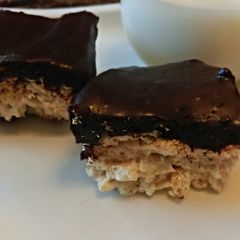 A picture of Fluff n Nutter Crispy Treats Topped In Dark Chocolate.