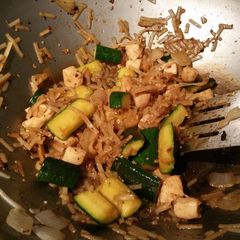 A picture of Hibachi style chicken, noodles and veggies.