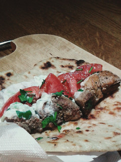 A picture of Greek souvlaki pork kebab and tzatziki sauce.