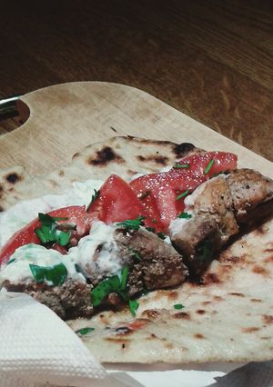 A picture of Greek souvlaki pork kebab and tzatziki sauce.