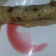 A picture of Pancake with jam sauce.