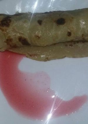 A picture of Pancake with jam sauce.