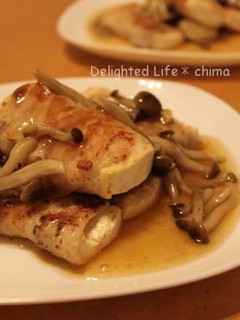 A picture of Pork and Tofu Rolls Topped with Mushroom Sauce.
