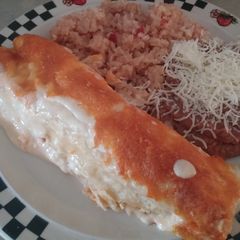 A picture of Cheesy chicken enchiladas.