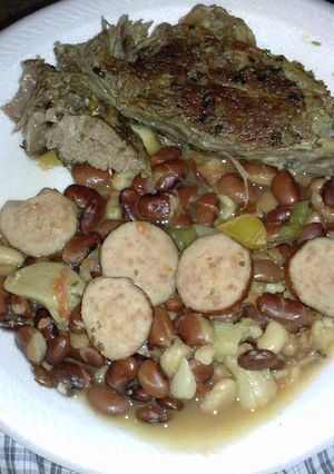 A picture of Chuck roast and pantry beans with hamhock and sausage.