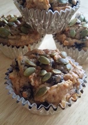 A picture of Carrot zucchini blueberry muffins.