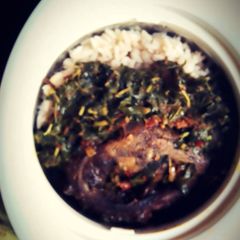 A picture of Rice & Beans with roasted fish & steamed Spinach.