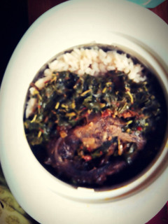 A picture of Rice & Beans with roasted fish & steamed Spinach.
