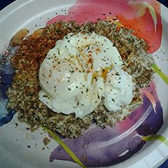 A picture of Cheesy sausage with poached eggs.
