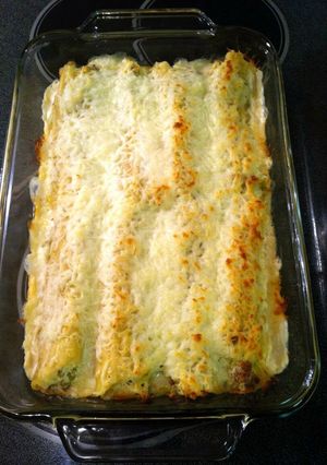 A picture of chicken and sausage stuffed manicotti.