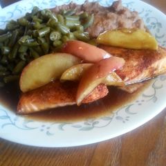 A picture of Baked salmon topped with caramelized apples.