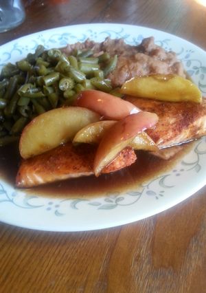 A picture of Baked salmon topped with caramelized apples.
