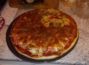 Una foto de Pizza bien peruana y buenasa