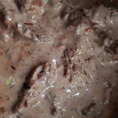 A picture of Chicken thighs in a port, wine and cream sauce.