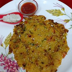 A picture of Leftover Poha chilla With Fresh Veggies.