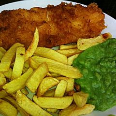 A picture of Tex's Proper Beer-Battered Fish & Chips with Mushy Peas 🐠🍟.