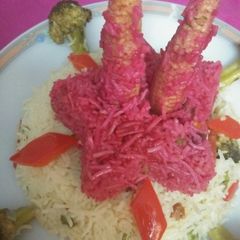 A picture of Pink rice / multiple of colored veggies.