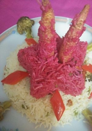 A picture of Pink rice / multiple of colored veggies.