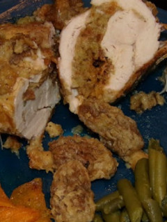 A picture of Stuffed Chicken Breast with Morel Mushrooms & Stuffing.