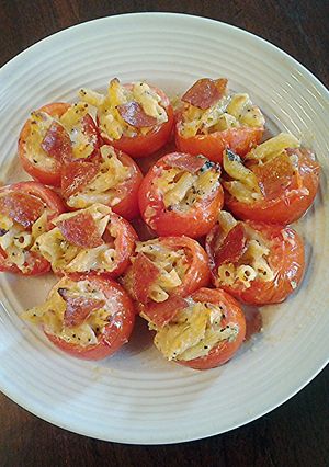 A picture of Macaroni and Cheese Stuffed Cherry Tomatoes.