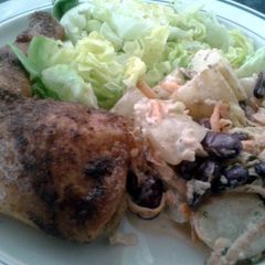 A picture of Roast chicken leg with apple and blue cheese potato salad..