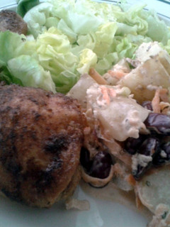 A picture of Roast chicken leg with apple and blue cheese potato salad..