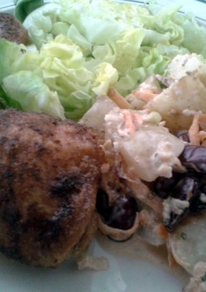 A picture of Roast chicken leg with apple and blue cheese potato salad..