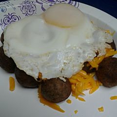 A picture of Eggs Over Cheesy Meatballs.