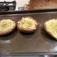 A picture of stuffed portabella mushrooms.