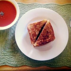 A picture of Grilled Cheese & Tomato soup.