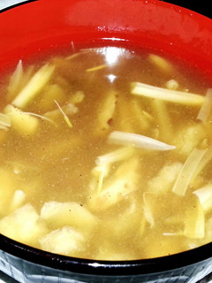 A picture of Fish maw soup with tiger lily and chinese mushroom.