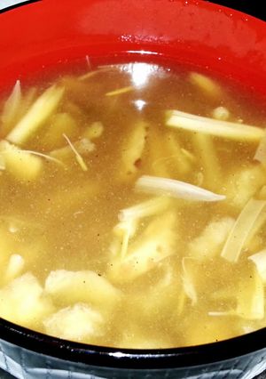 A picture of Fish maw soup with tiger lily and chinese mushroom.
