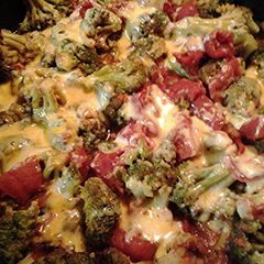 A picture of Cheesy Stewed tomatoes and broccoli.