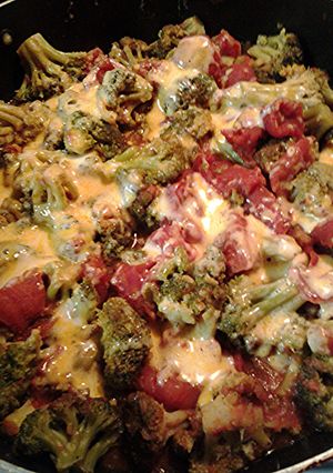 A picture of Cheesy Stewed tomatoes and broccoli.