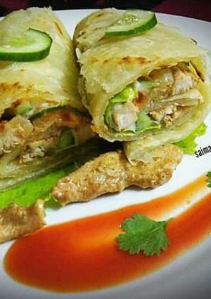 A picture of Creamy chicken roll paratha with mayo garlic sauce.