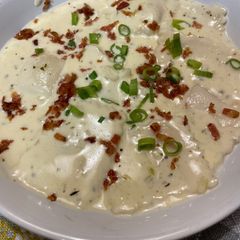 A picture of Ravioli in Alfredo Sauce.