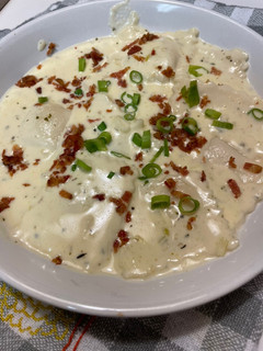 A picture of Ravioli in Alfredo Sauce.