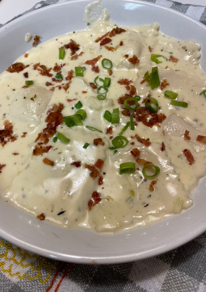 A picture of Ravioli in Alfredo Sauce.