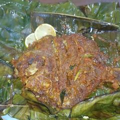 A picture of Meen pollichathu/ Fish fried in banana leaf wrap.