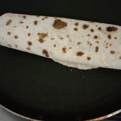 A picture of Leftover rice veg and egg roll.