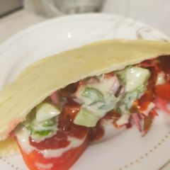 A picture of Pita bread packet vegetable sandwich.