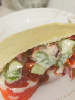 A picture of Pita bread packet vegetable sandwich.