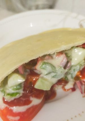 A picture of Pita bread packet vegetable sandwich.