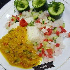 A picture of Boiled Daal Masoor with plain rice and Salad.