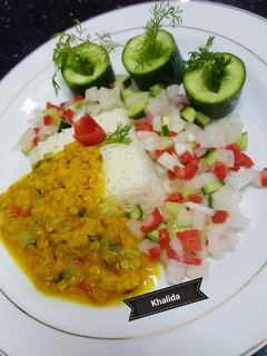 A picture of Boiled Daal Masoor with plain rice and Salad.