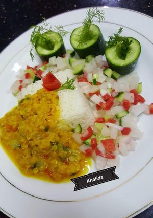 A picture of Boiled Daal Masoor with plain rice and Salad.