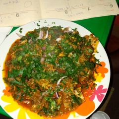 A picture of Isi-ewu with utazi leaves.