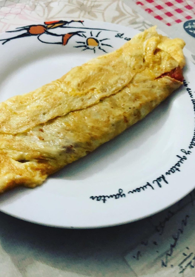 Una foto de Tortilla rellena de pisto de calabacín